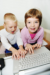 Image showing childrens have fun and playing games on laptop computer