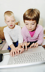 Image showing childrens have fun and playing games on laptop computer