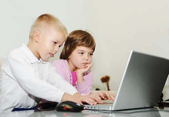 Image showing childrens have fun and playing games on laptop computer