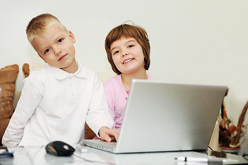 Image showing childrens have fun and playing games on laptop computer