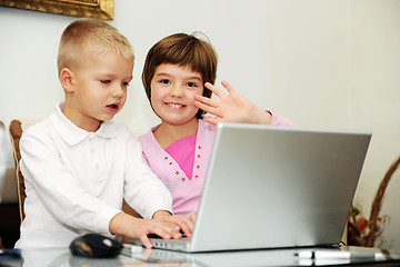 Image showing childrens have fun and playing games on laptop computer