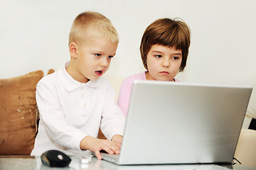 Image showing childrens have fun and playing games on laptop computer