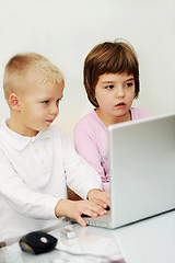 Image showing childrens have fun and playing games on laptop computer