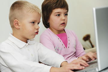 Image showing childrens have fun and playing games on laptop computer