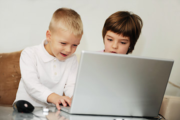 Image showing childrens have fun and playing games on laptop computer