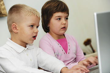 Image showing childrens have fun and playing games on laptop computer