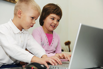 Image showing childrens have fun and playing games on laptop computer