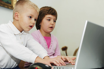 Image showing childrens have fun and playing games on laptop computer