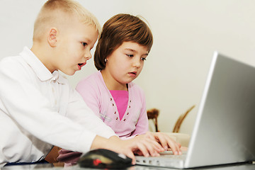 Image showing childrens have fun and playing games on laptop computer