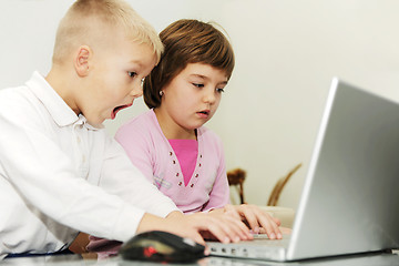 Image showing childrens have fun and playing games on laptop computer