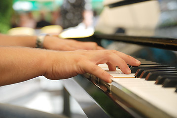 Image showing Man playing melody on piano