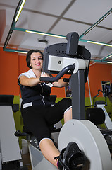 Image showing Young woman working out in gym