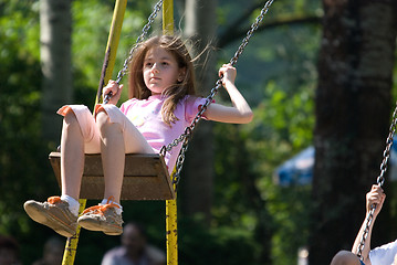 Image showing happy girl swinging 