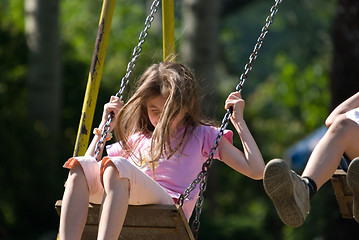 Image showing happy girl swinging 