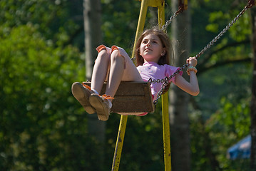 Image showing happy girl swinging 