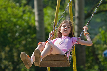 Image showing happy girl swinging 