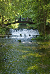 Image showing wooden bring over small waterfall 