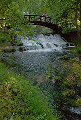 Image showing wooden bring over small waterfall 