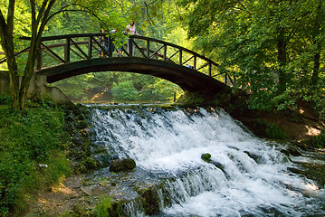 Image showing wooden bring over small waterfall 