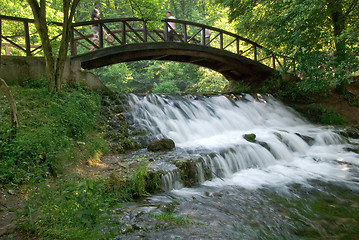 Image showing wooden bring over small waterfall 