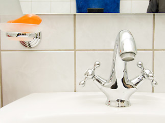 Image showing retro tap and orange soap