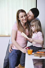 Image showing happy young family in kitchen