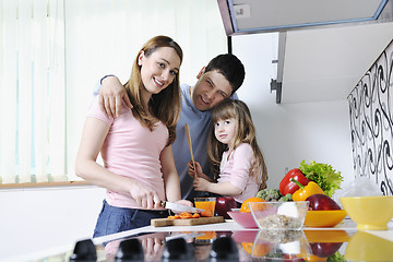 Image showing happy young family in kitchen