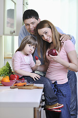 Image showing happy young family in kitchen