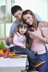 Image showing happy young family in kitchen