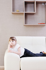 Image showing cute girl on sofa at hoe