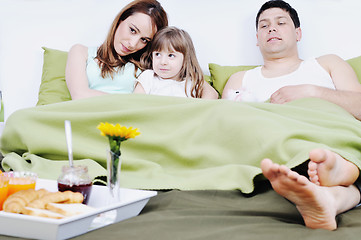 Image showing happy young family eat breakfast in bed