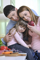 Image showing happy young family in kitchen