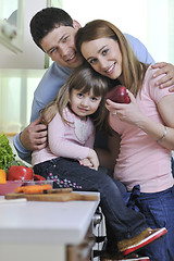 Image showing happy young family in kitchen