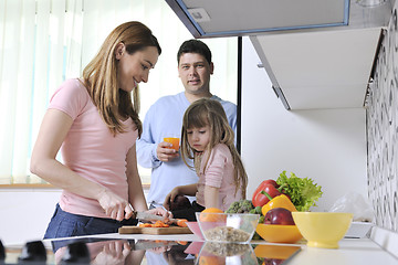 Image showing happy young family in kitchen