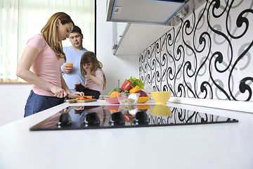 Image showing happy young family in kitchen