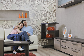 Image showing couple relax at home on sofa in living room