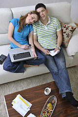 Image showing young couple working on laptop at home