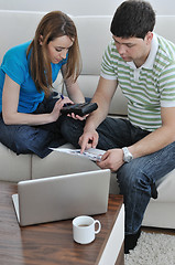 Image showing young couple working on laptop at home