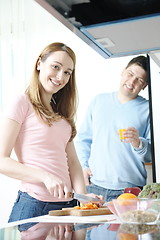 Image showing couple have fun and preparing healthy food in kitchen