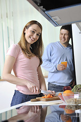 Image showing couple have fun and preparing healthy food in kitchen