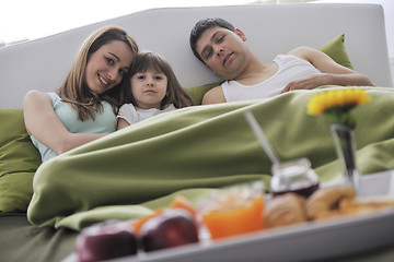 Image showing happy young family eat breakfast in bed