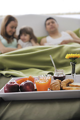 Image showing happy young family eat breakfast in bed