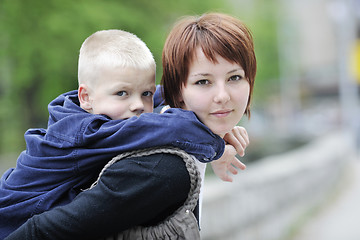 Image showing happy boy and mom outdoor