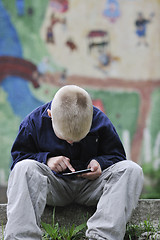 Image showing playing video games outdoor