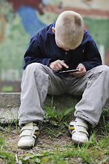 Image showing playing video games outdoor