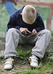 Image showing playing video games outdoor