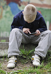 Image showing playing video games outdoor