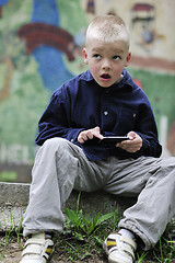 Image showing playing video games outdoor