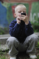 Image showing playing video games outdoor