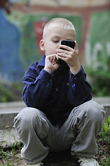 Image showing playing video games outdoor